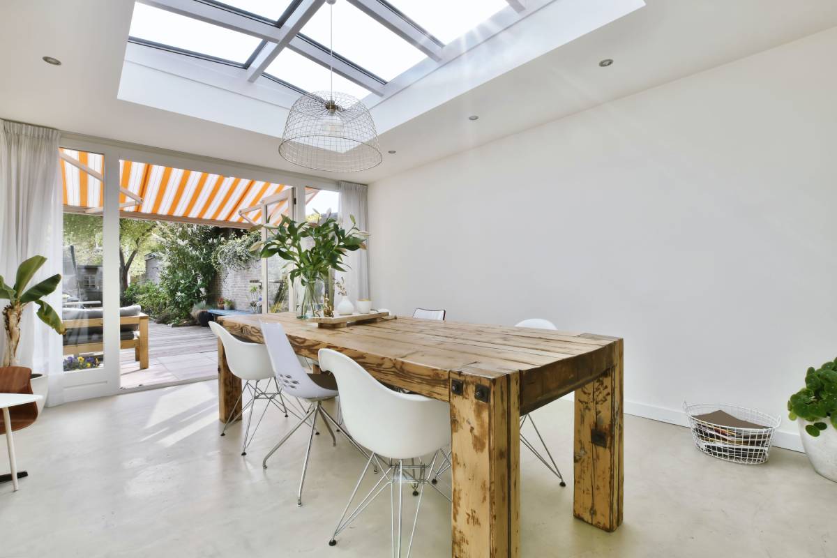 Elite dining area with glass ceiling and white walls