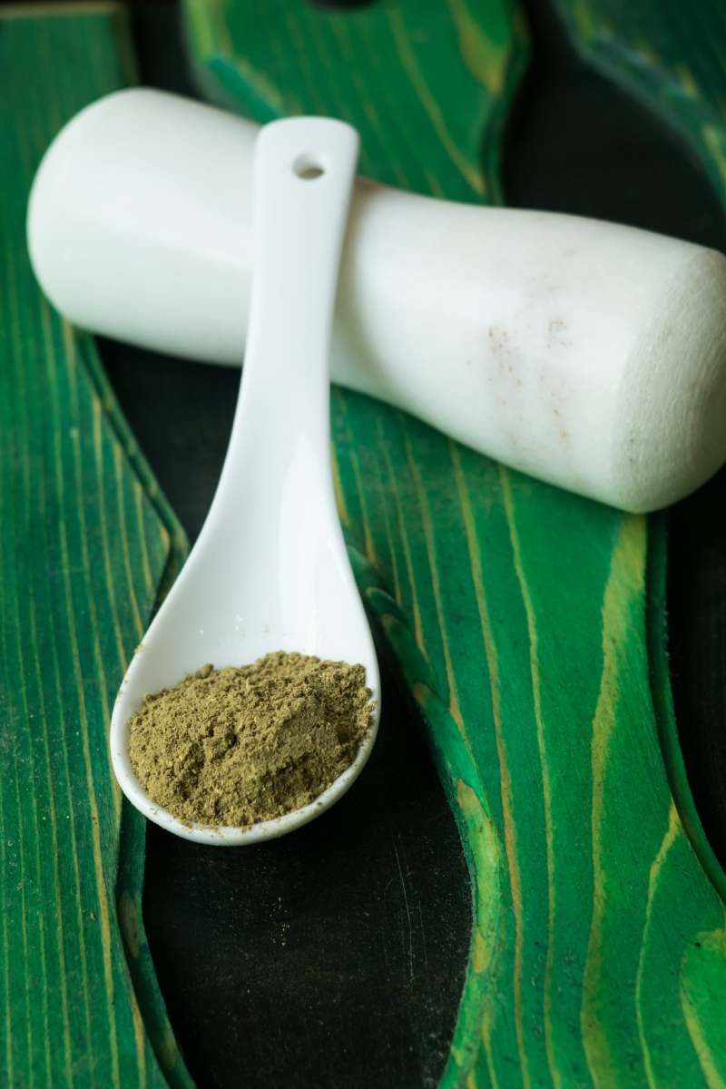 ground celery seed in a white ceramic spoon