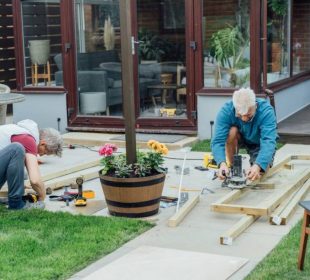 adult-son-and-father-carpenter-working-together-h-2023-11-27-05-23-07-utc-1-905x613