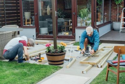 adult-son-and-father-carpenter-working-together-h-2023-11-27-05-23-07-utc-1-905x613