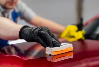 man-worker-of-car-detailing-studio-applying-cerami-2021-08-29-11-02-37-utc-1-905x613