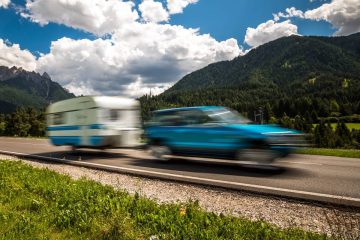 Family vacation travel, holiday trip in motorhome RV, Caravan car Vacation. Beautiful Nature Italy natural landscape Alps. Warning - authentic shooting there is a motion blur.