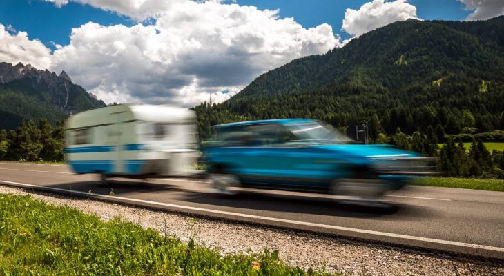 Family vacation travel, holiday trip in motorhome RV, Caravan car Vacation. Beautiful Nature Italy natural landscape Alps. Warning - authentic shooting there is a motion blur.
