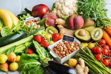 Balanced nutrition concept for clean eating alkaline diet. Assortment of healthy food ingredients for cooking on a kitchen table