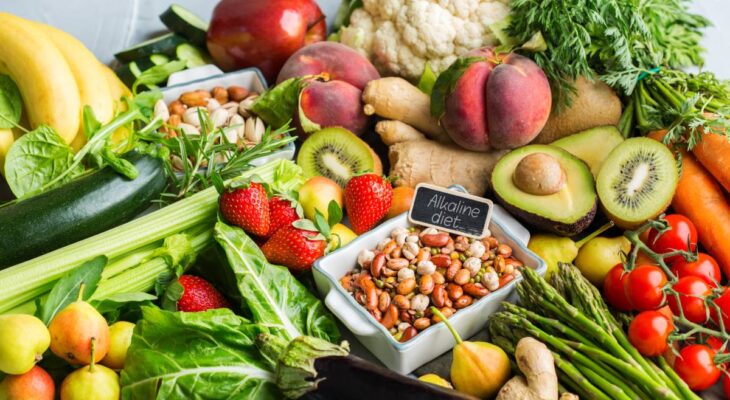 Balanced nutrition concept for clean eating alkaline diet. Assortment of healthy food ingredients for cooking on a kitchen table