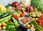 Balanced nutrition concept for clean eating alkaline diet. Assortment of healthy food ingredients for cooking on a kitchen table